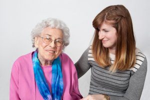 Care Advisor sitting with older woman to discuss in home services
