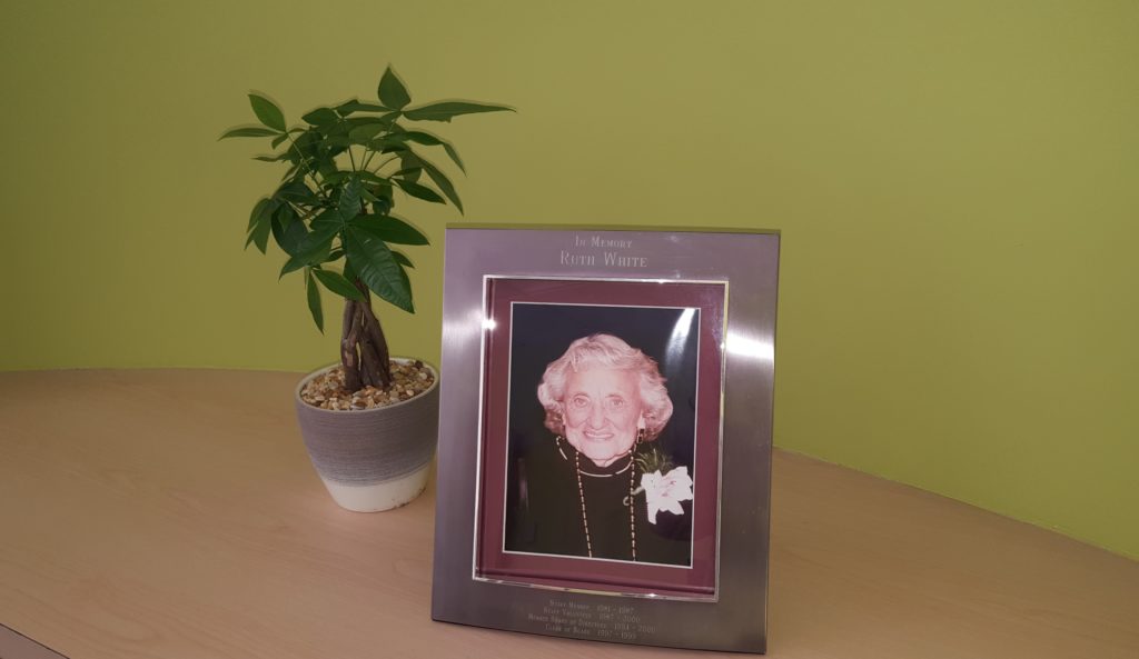 framed photo of Ruth White sitting on a table